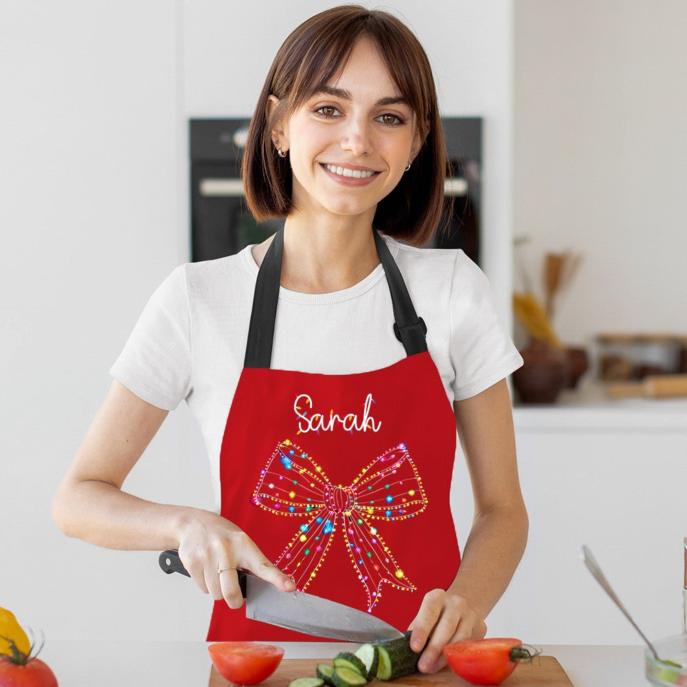 Custom Name Christmas Light Coquette Bow Apron, Kitchen Apron with Pocket & Adjustable Strap, Kitchen Accessory, Christmas Gift for Mother/Grandma/Her